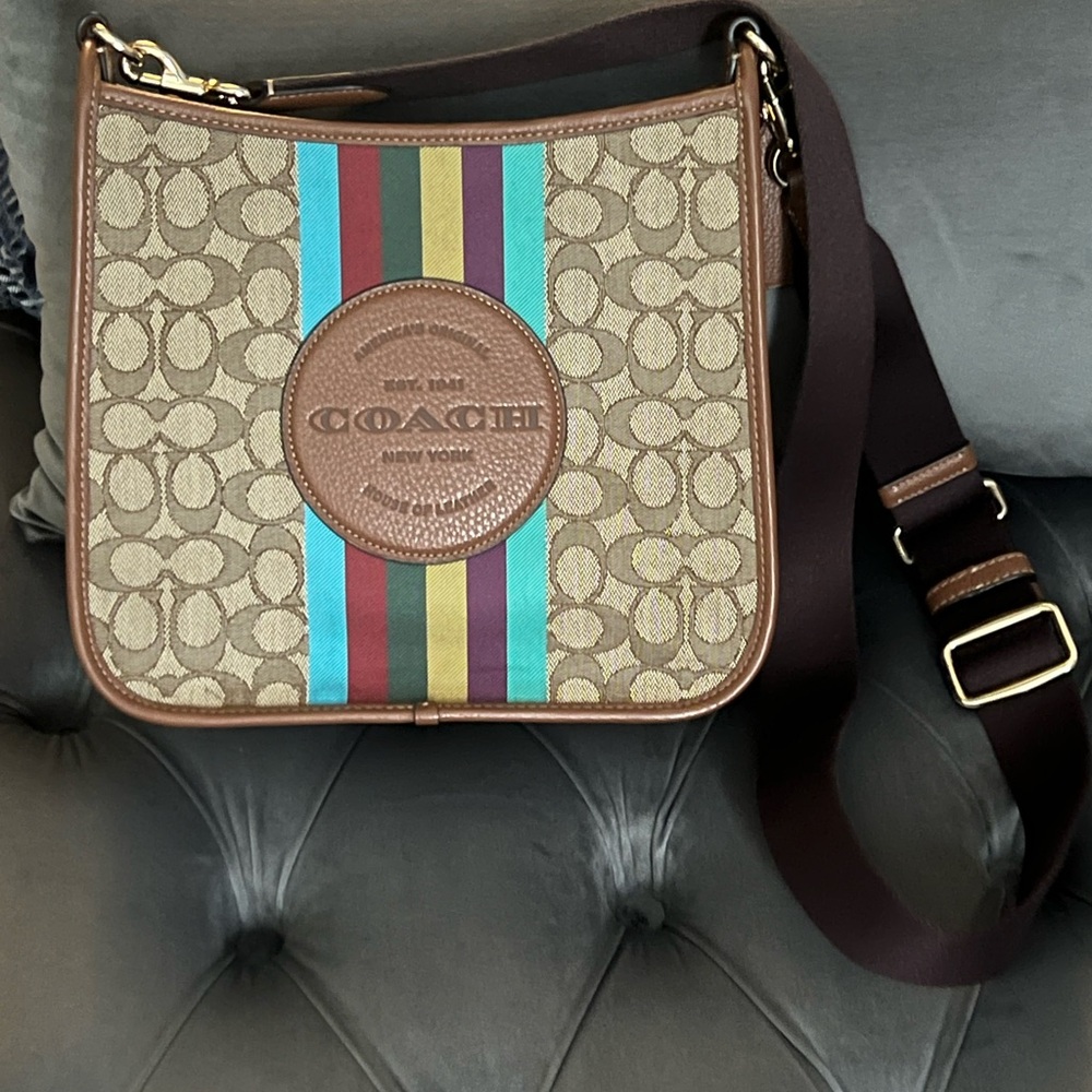 Coach Tan and Multicolor Dempsey crossbody bag.